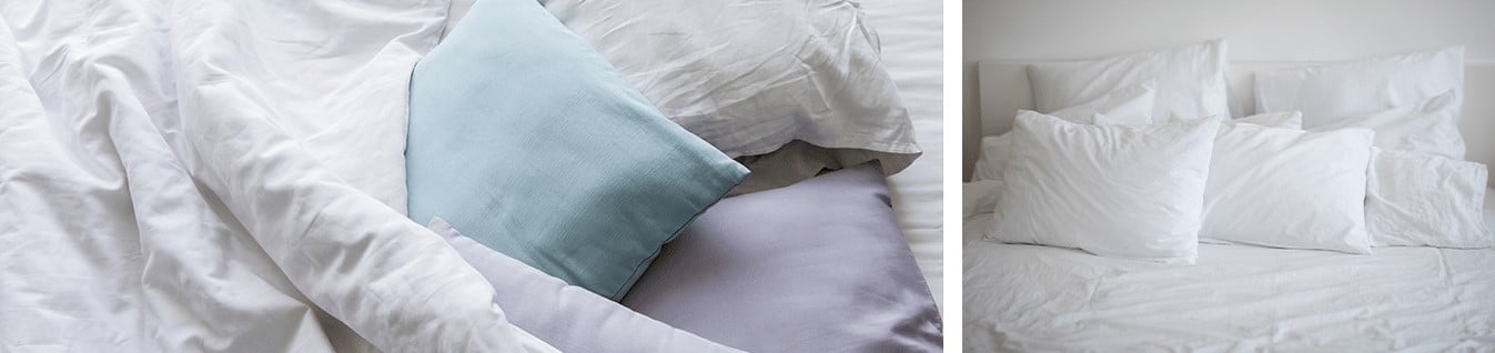 coussin couleur pale bleu violet et couaains blacs sur lit blanc